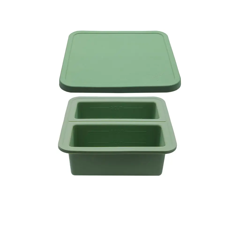 FDA-approved silicone freezer trays in two-portion and four-portion sizes, filled with home-cooked meals and designed for easy portioning and freezing.