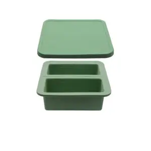 FDA-approved silicone freezer trays in two-portion and four-portion sizes, filled with home-cooked meals and designed for easy portioning and freezing.